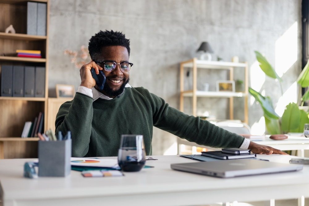 https://www.shutterstock.com/image-photo/happy-man-working-home-office-talking-2711982789